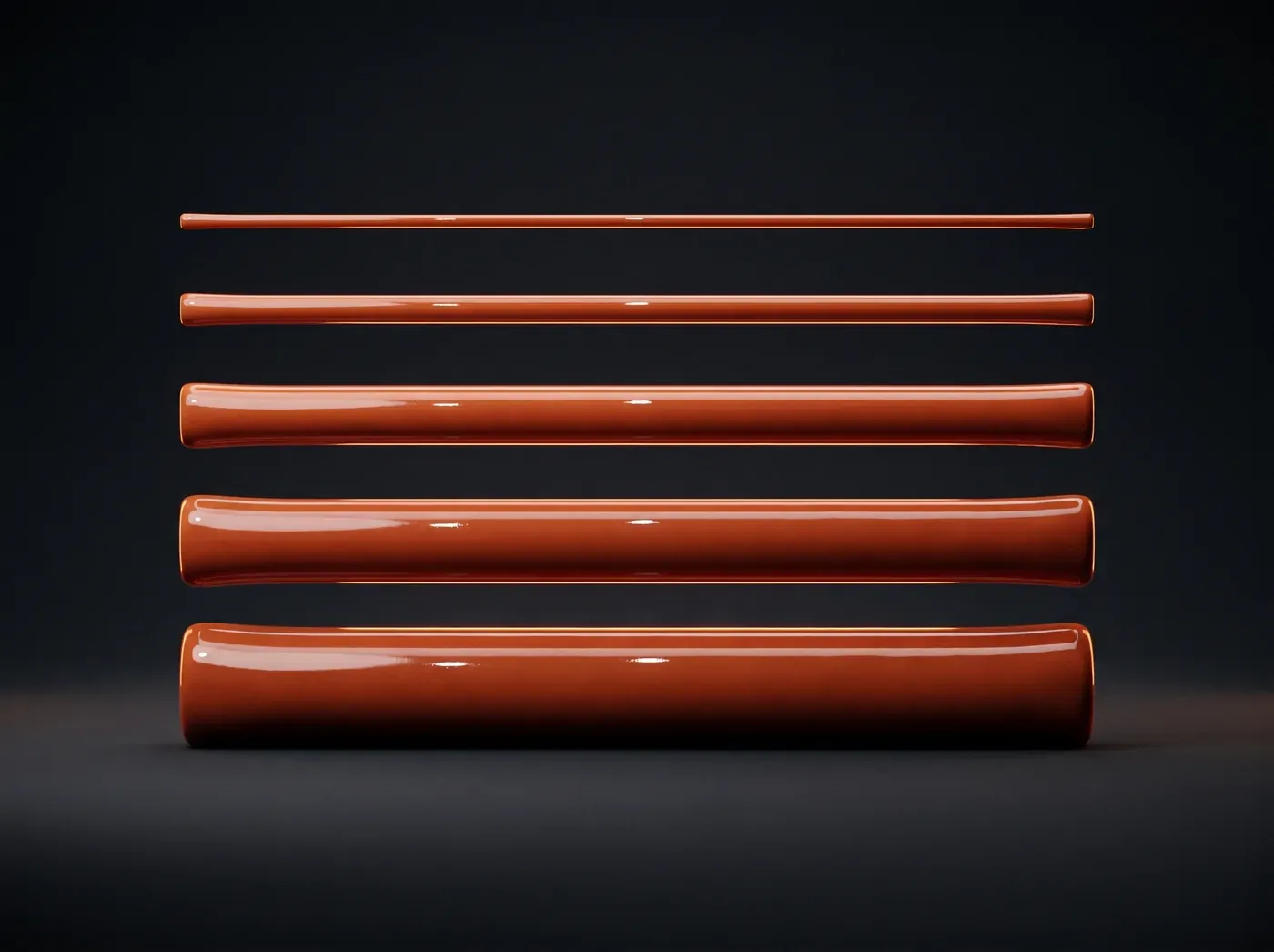 Five glossy cords of increasing thickness stacked in parallel, a weight scale.