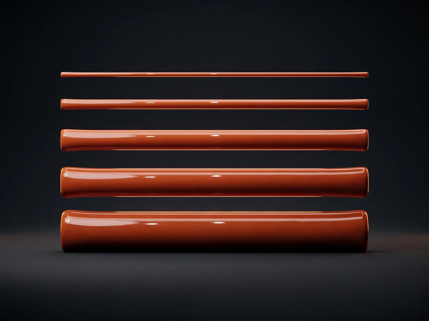 Five glossy cords of increasing thickness stacked in parallel, a weight scale.