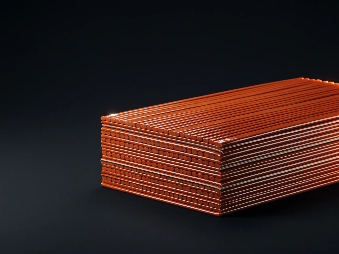 Cords pressed flat and fused into a stack of sheets, the layered edge facing camera.
